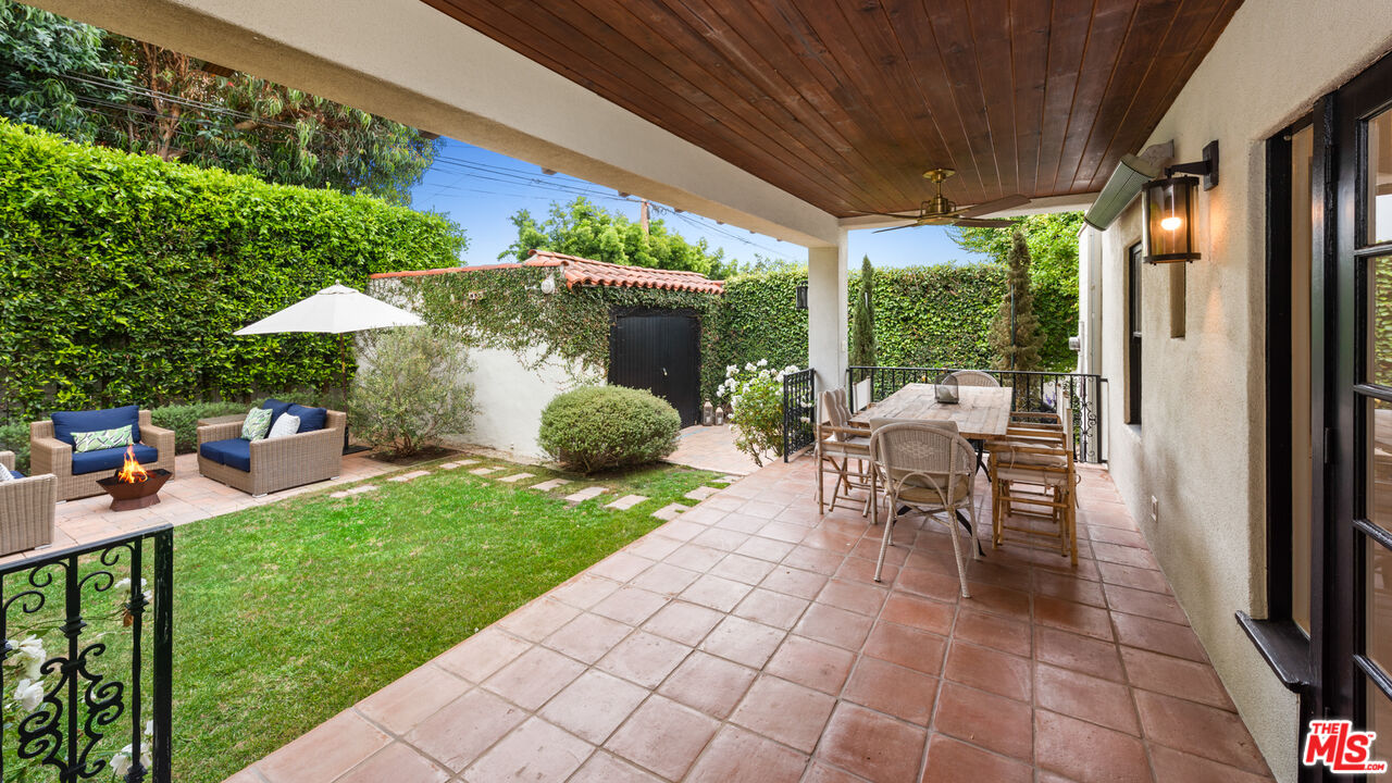 1146 Grant Avenue Venice, CA 90291 - Photo 9 of 20 a view of a patio with table and chairs potted plants with wooden floor