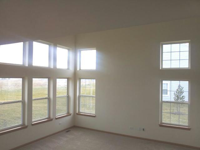 1037 Key Largo Drive Romeoville, IL 60446 - Photo 11 of 23 an empty room with windows