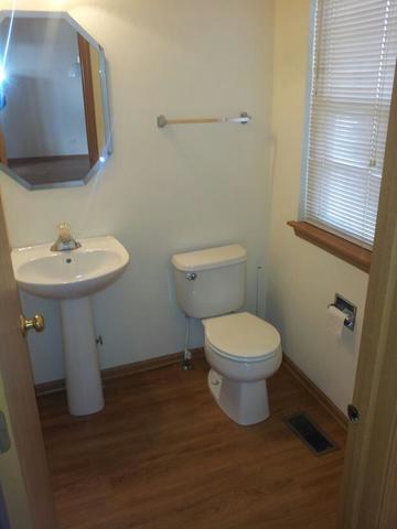 1037 Key Largo Drive Romeoville, IL 60446 - Photo 12 of 23 a bathroom with a toilet a sink and mirror
