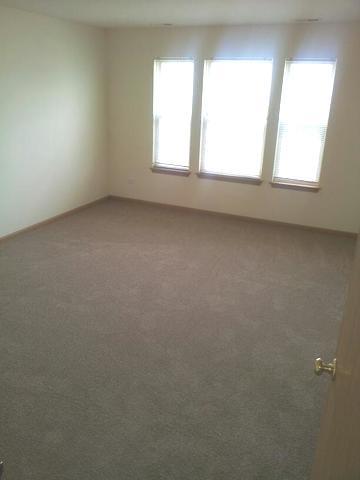 1037 Key Largo Drive Romeoville, IL 60446 - Photo 17 of 23 an empty room with a window