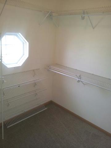 1037 Key Largo Drive Romeoville, IL 60446 - Photo 18 of 23 a view of a small space with racks on the wall