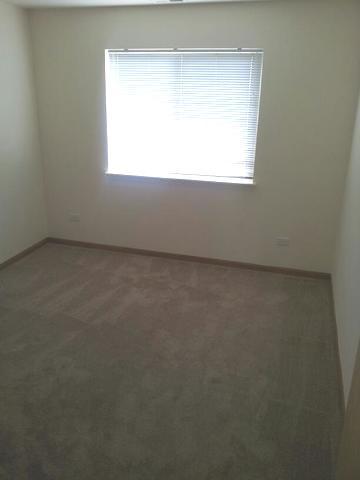 1037 Key Largo Drive Romeoville, IL 60446 - Photo 20 of 23 an empty room with a window