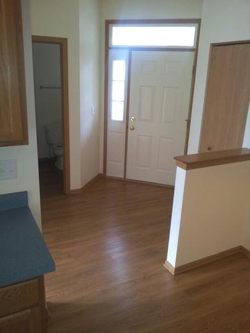 1037 Key Largo Drive Romeoville, IL 60446 - Photo 3 of 23 an empty room with wooden floor and windows