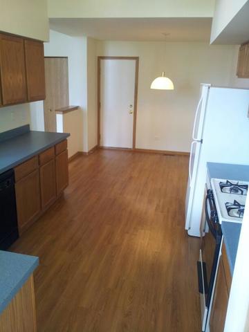 1037 Key Largo Drive Romeoville, IL 60446 - Photo 5 of 23 a kitchen with sink and cabinets
