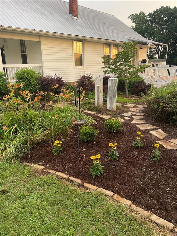 1815 Pickens Street Ball Ground, GA 30107 - Photo 18 of 38 a front view of a house with garden