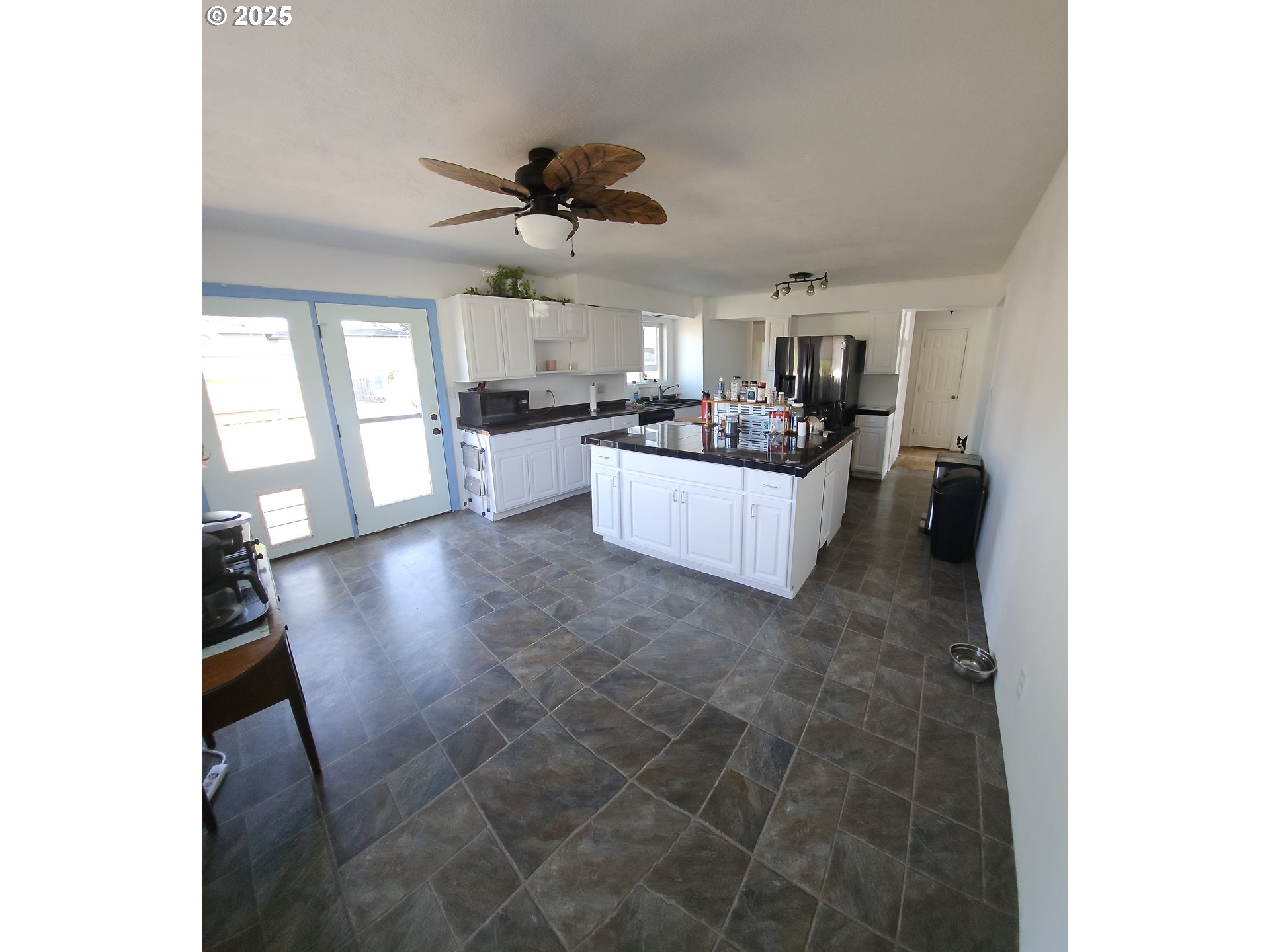 3142 Maple Street Longview, WA 98632 - Photo 10 of 15 a living room with a couch and a ceiling fan