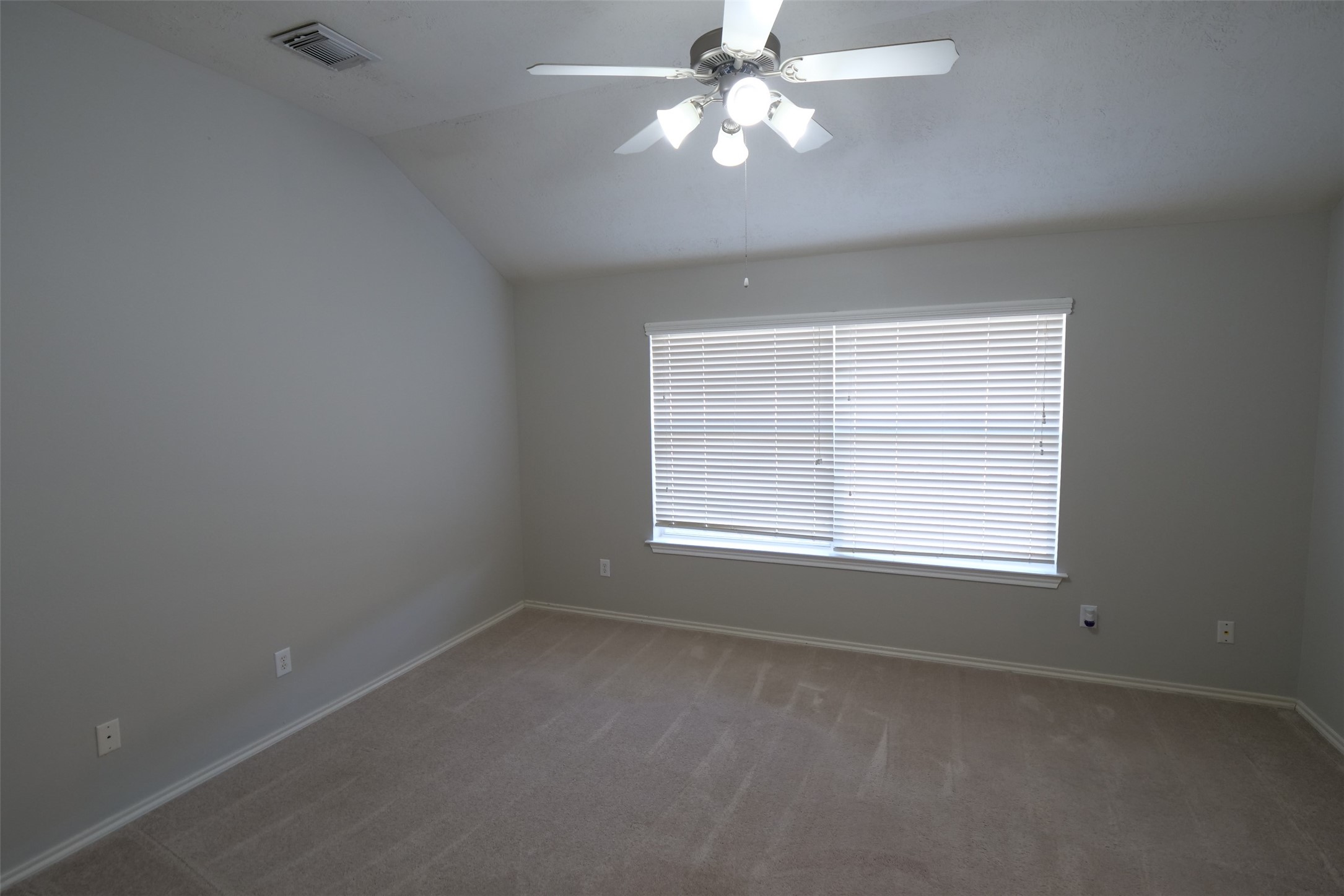 5414 Trammel Drive Spring, TX 77388 - Photo 12 of 28 an empty room with a window and a fan