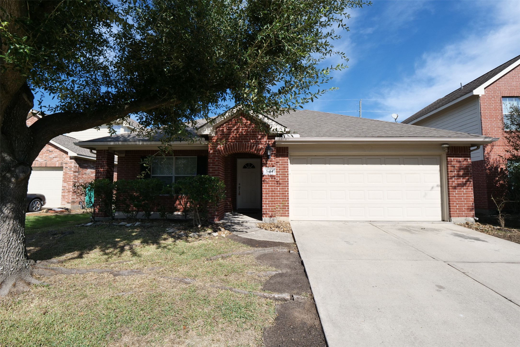 5414 Trammel Drive Spring, TX 77388 - Photo 2 of 28 a view of a house with a yard and garage