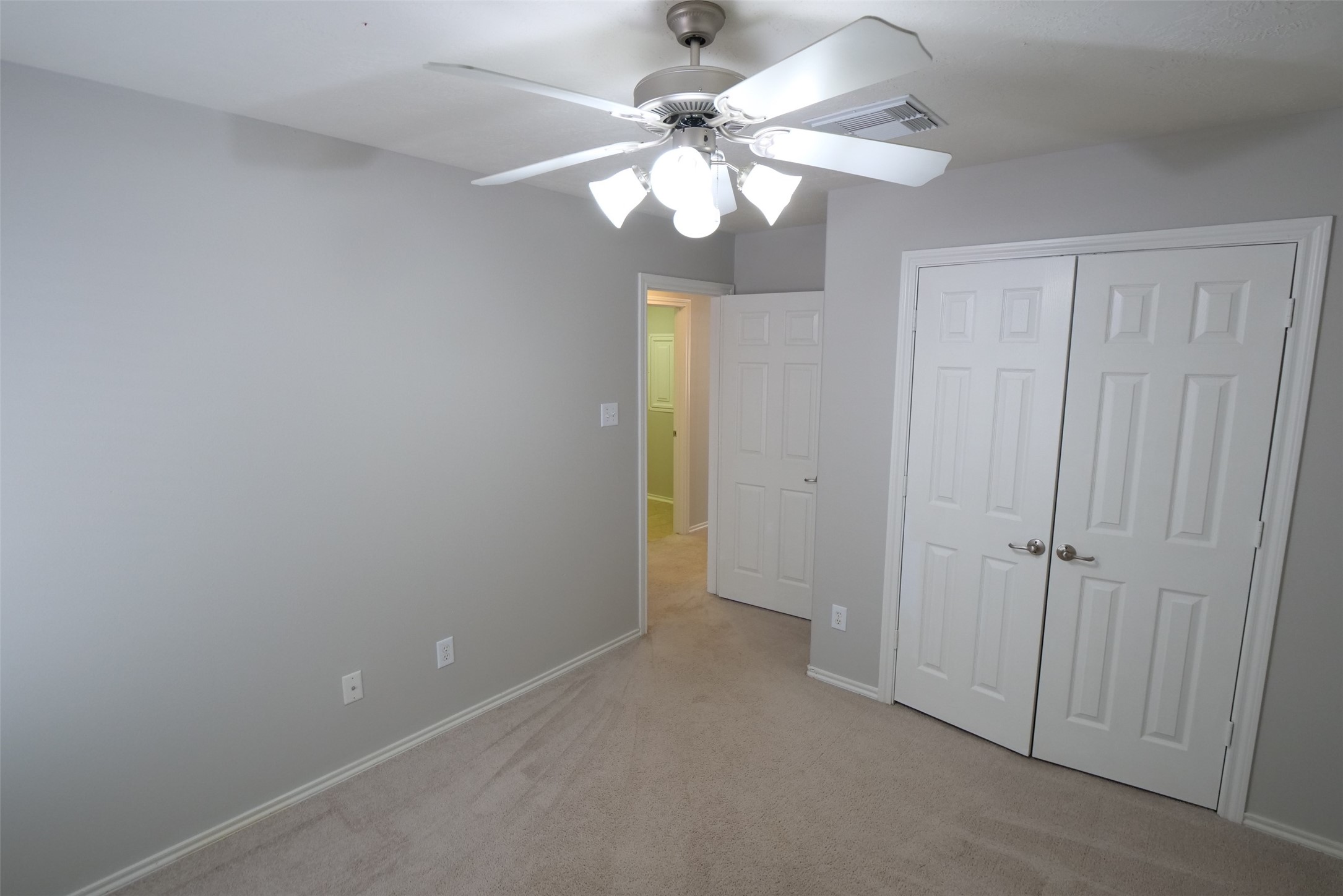 5414 Trammel Drive Spring, TX 77388 - Photo 23 of 28 a view of an empty room with a chandelier fan