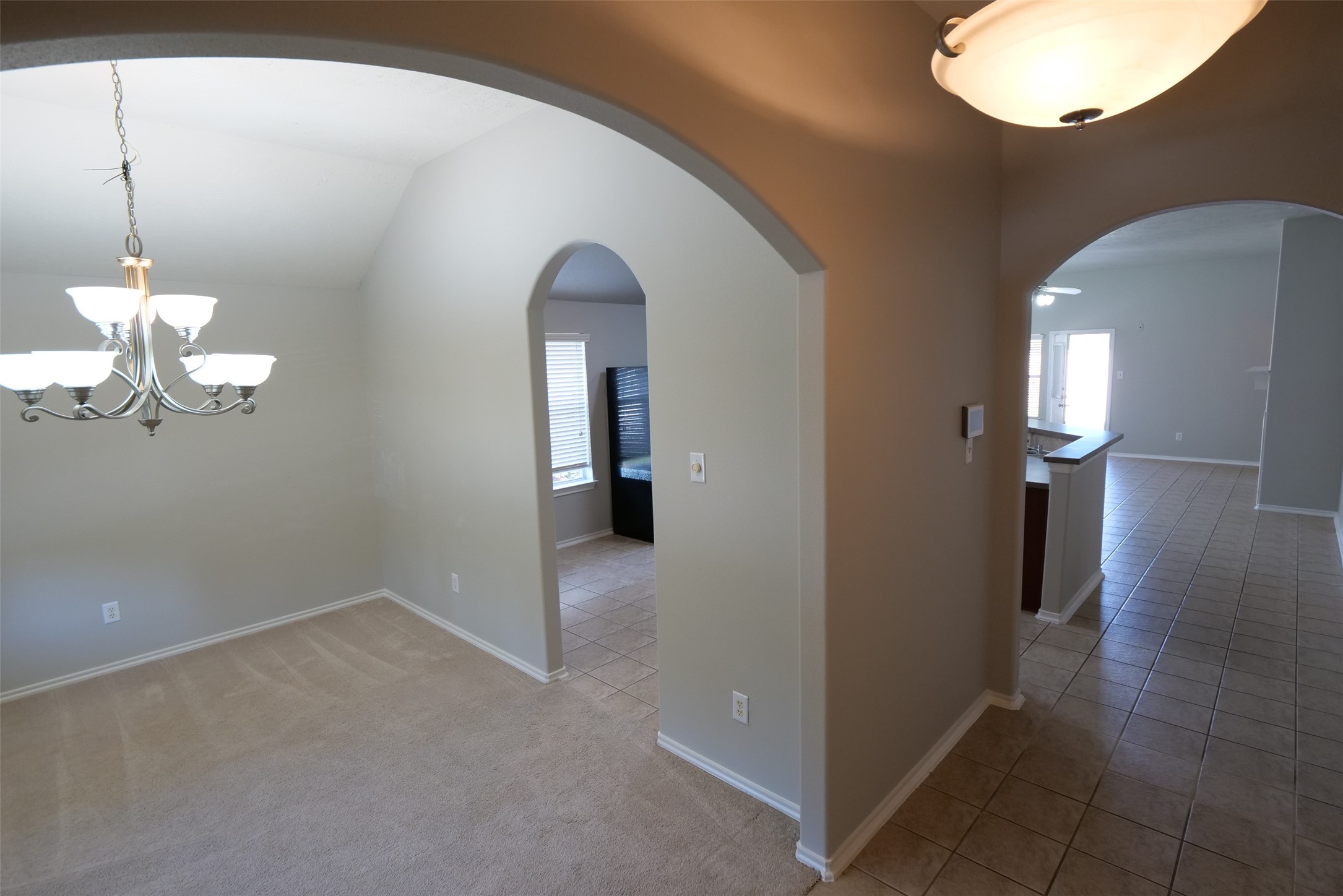 5414 Trammel Drive Spring, TX 77388 - Photo 3 of 28 a view of a room with a chandelier fan and windows
