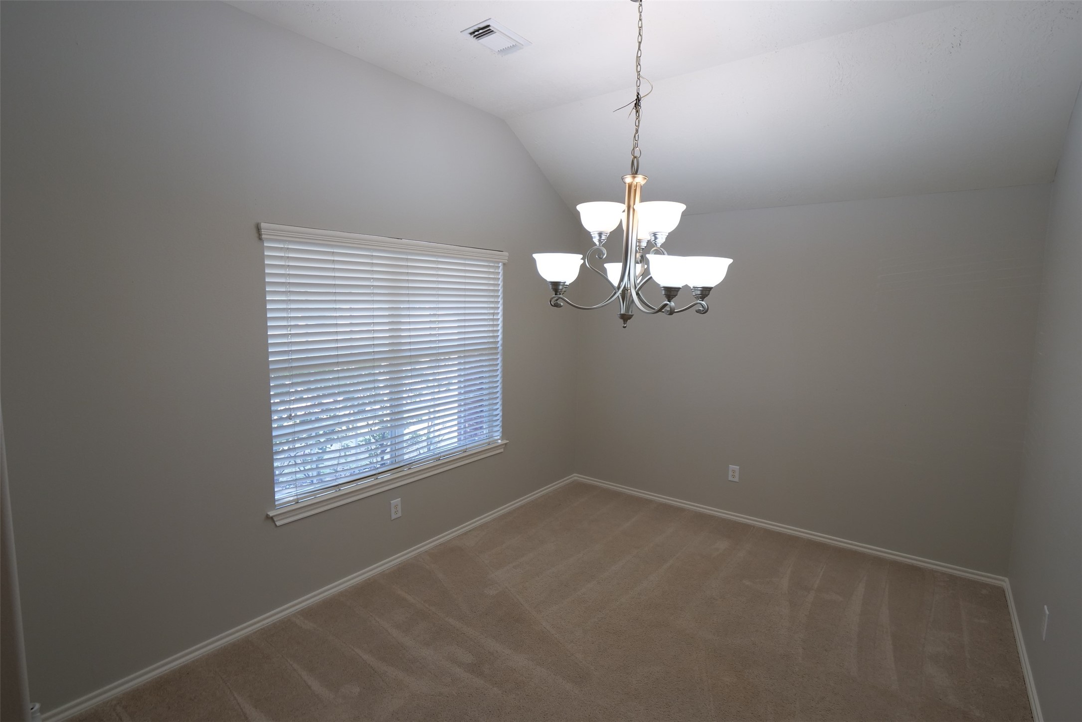 5414 Trammel Drive Spring, TX 77388 - Photo 4 of 28 a view of a room with a chandelier fan and a window