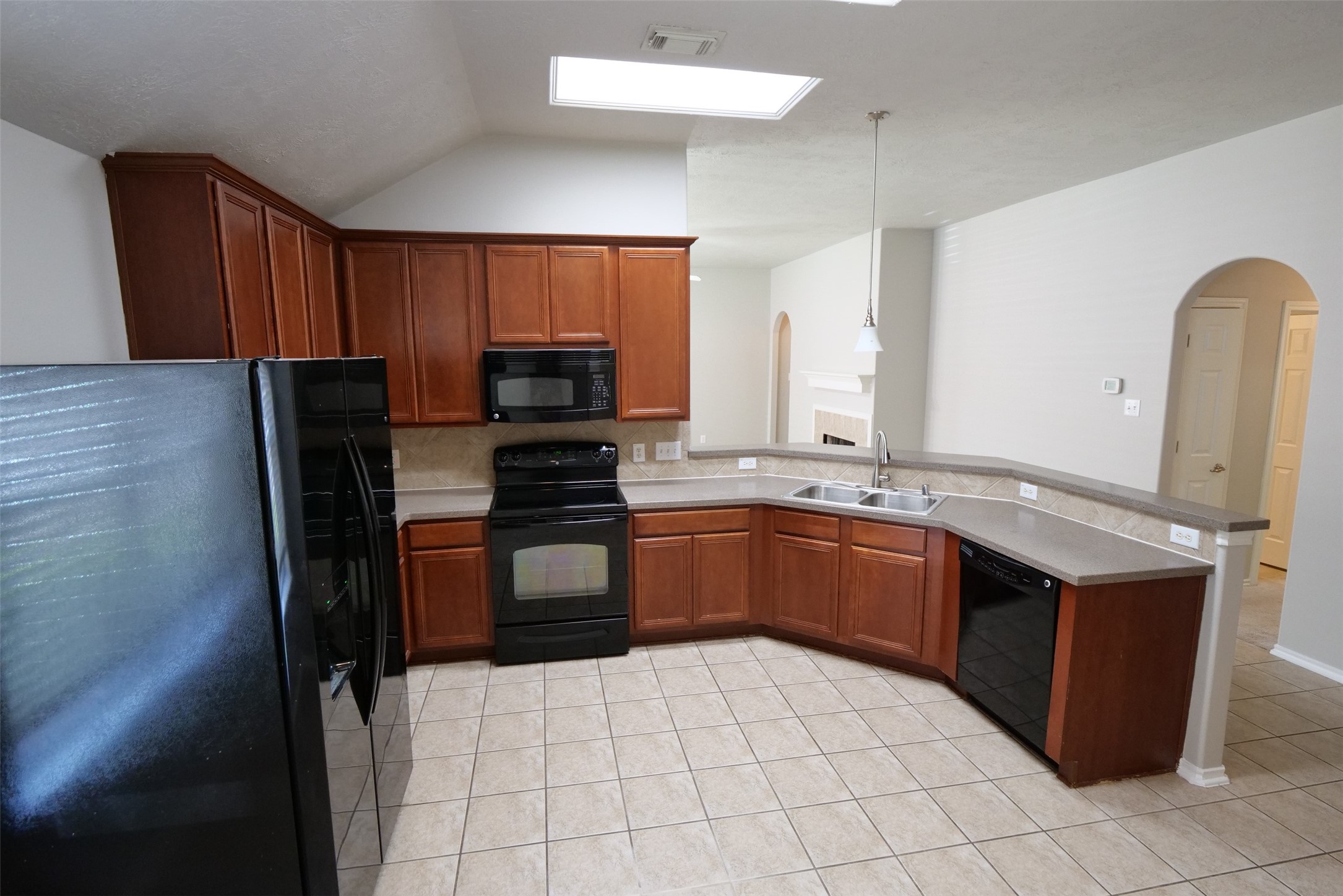 5414 Trammel Drive Spring, TX 77388 - Photo 6 of 28 a kitchen with stainless steel appliances a sink stove and refrigerator