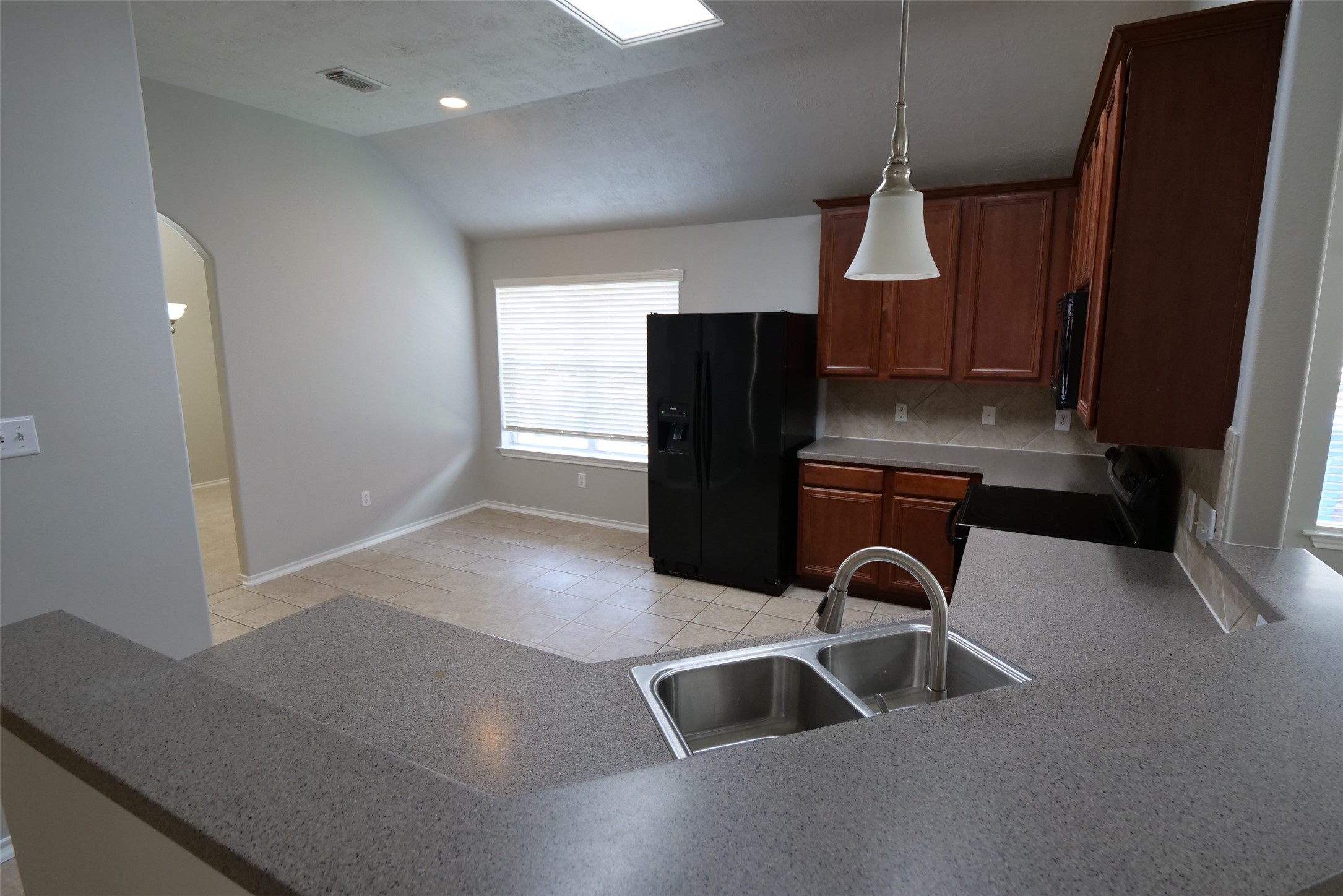 5414 Trammel Drive Spring, TX 77388 - Photo 8 of 28 a kitchen with refrigerator and window