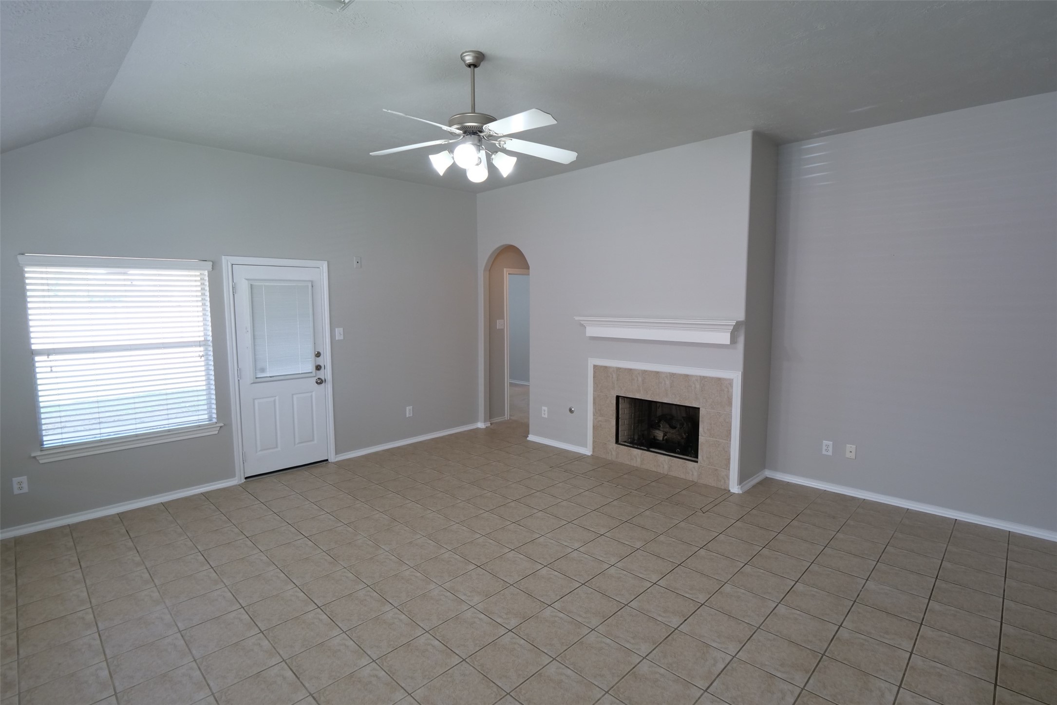 5414 Trammel Drive Spring, TX 77388 - Photo 10 of 28 a view of a livingroom with a fireplace and chandelier fan