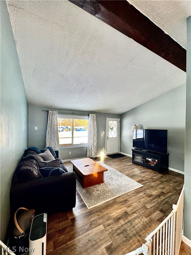 2852 Shelly Road Ravenna, OH 44266 - Photo 3 of 30 Living area featuring dark wood finished floors and baseboards