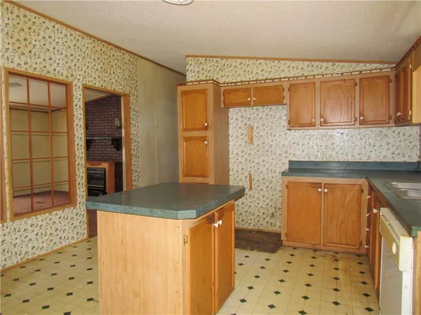 a bathroom with a sink a mirror and shower
