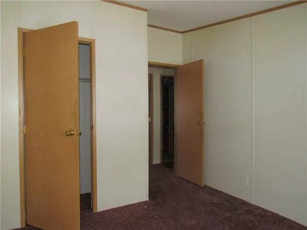 a bedroom with bed and window