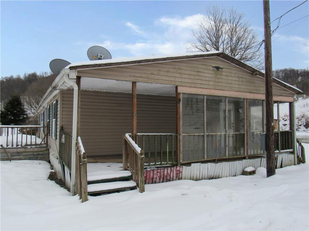 121 Hoy Run Road Spraggs, PA 15362 - Photo 3 of 25 a view of backyard with cabin and wooden fence