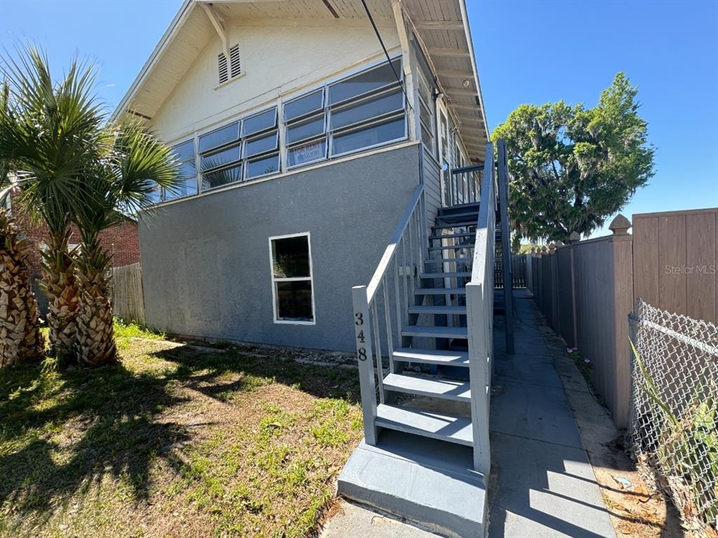 348 South Central Avenue, Unit U Umatilla, FL 32784 - Photo 1 of 13 a backyard of a house with lots of green space