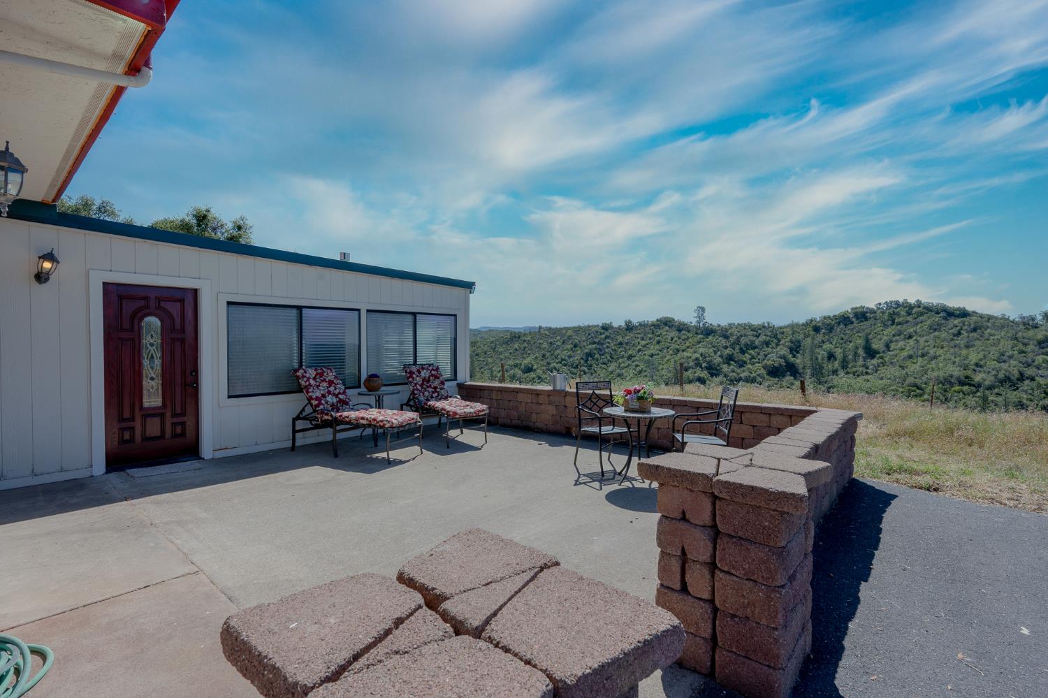 5912 Old Gulch Road San Andreas, CA 95249 - Photo 27 of 71 a view of a terrace with couches and sky view