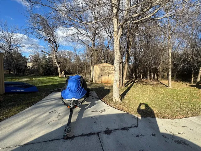 a view of a swimming pool with a yard