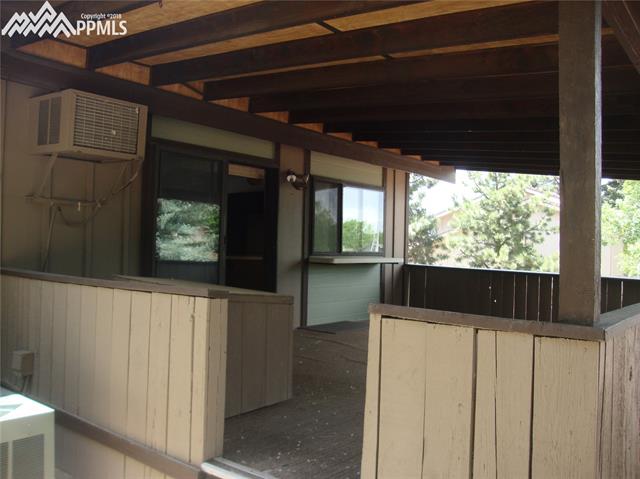 2965 Valencia Road Colorado Springs, CO 80917 - Photo 9 of 22 Covered porch comes right off the dining room. Such great space for entertaining. All your friends and family will love the space to visit and play both inside and outside in this great home!