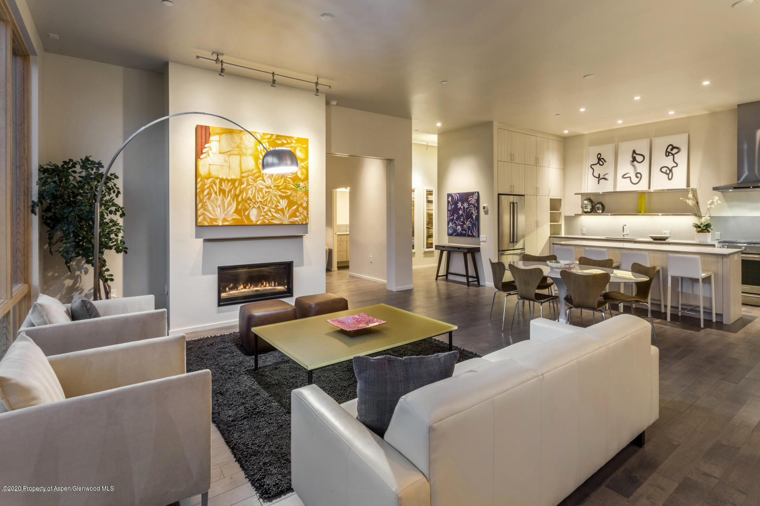 a living room with furniture fireplace and a table