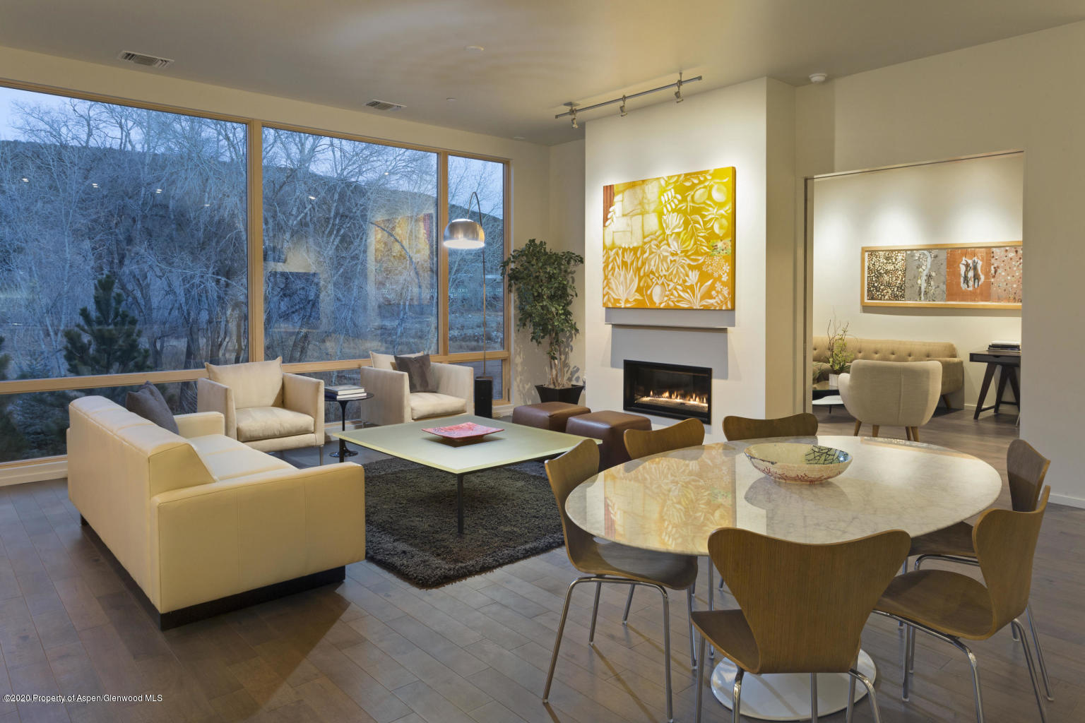 101 Willits Lane, Unit 107 Basalt, CO 81621 - Photo 2 of 16 a living room with fireplace furniture and a floor to ceiling window
