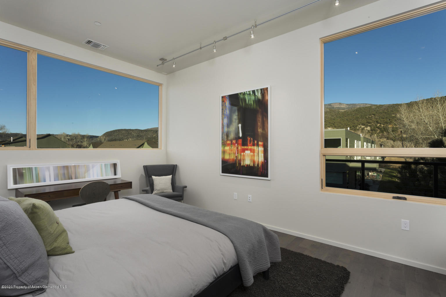 101 Willits Lane, Unit 107 Basalt, CO 81621 - Photo 8 of 16 a bedroom with a bed and glass window