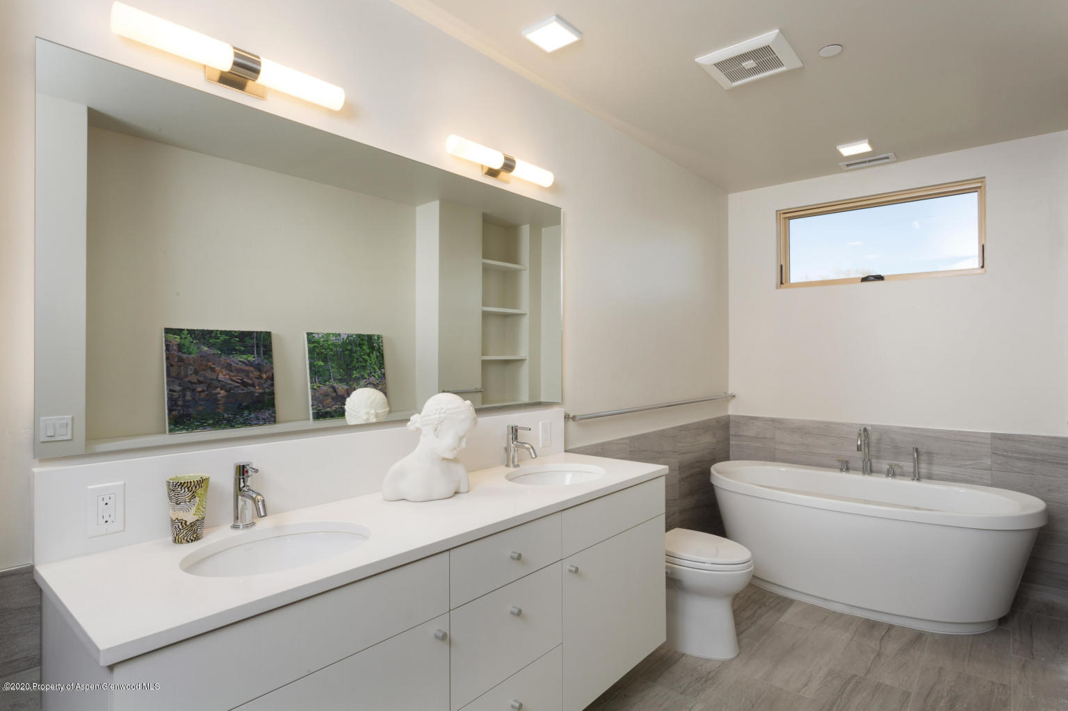 101 Willits Lane, Unit 107 Basalt, CO 81621 - Photo 10 of 16 a bathroom with a toilet a sink a mirror and bathtub