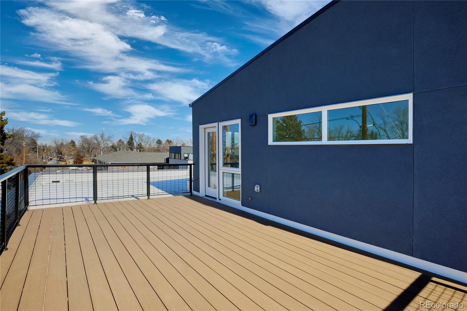 2951 East Evans Avenue Denver, CO 80210 - Photo 14 of 39 a bedroom with a bed and a night stand