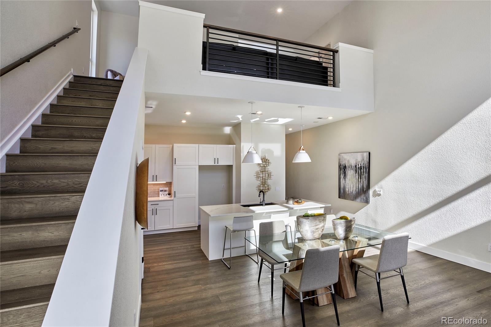 2951 East Evans Avenue Denver, CO 80210 - Photo 15 of 39 a dining room with furniture and wooden floor
