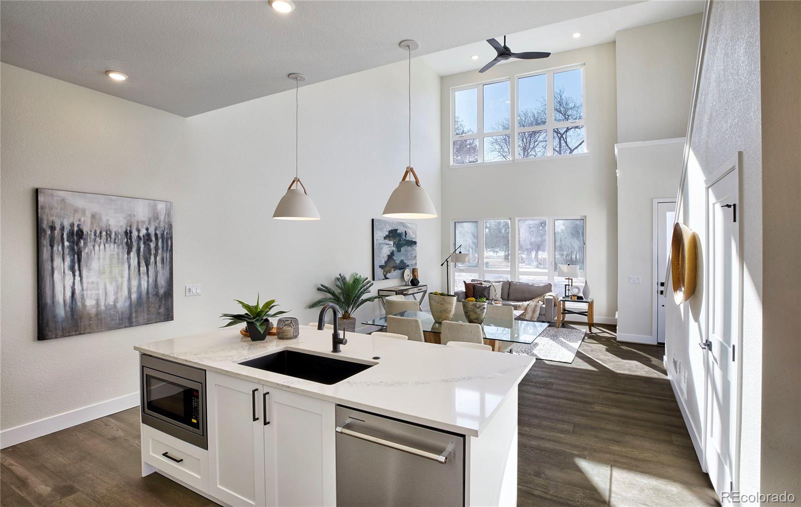 2951 East Evans Avenue Denver, CO 80210 - Photo 2 of 39 a kitchen with a sink and a stove top oven
