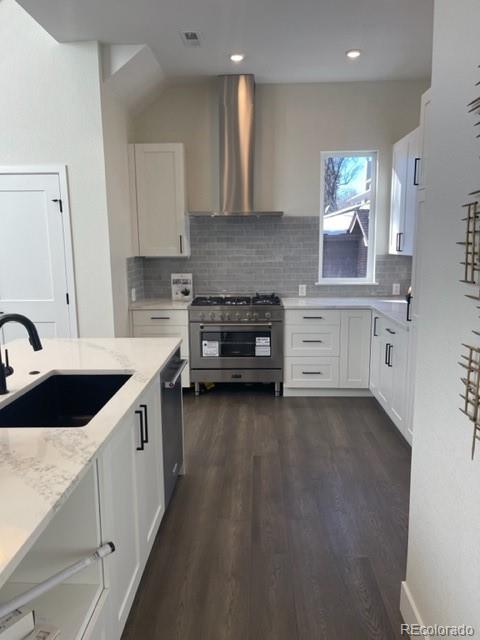 2951 East Evans Avenue Denver, CO 80210 - Photo 30 of 39 a kitchen with a sink stove and cabinets