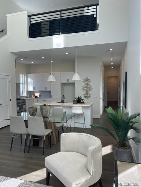 2951 East Evans Avenue Denver, CO 80210 - Photo 31 of 39 a living room with furniture and a potted plant