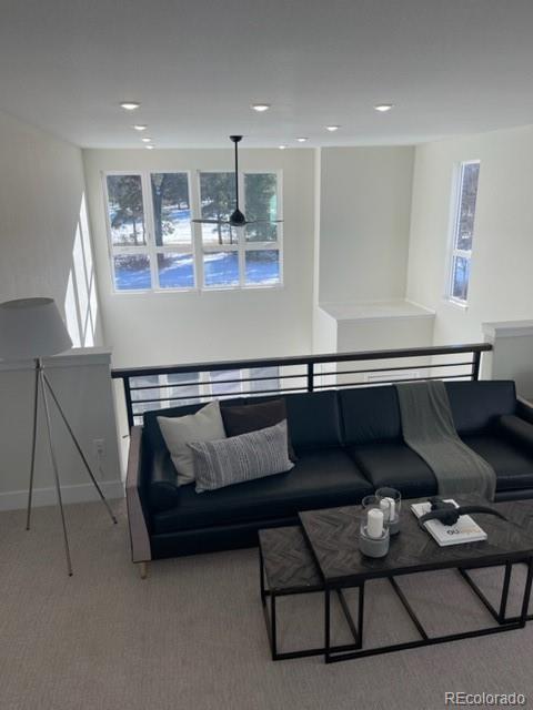 2951 East Evans Avenue Denver, CO 80210 - Photo 33 of 39 a living room with furniture and kitchen view