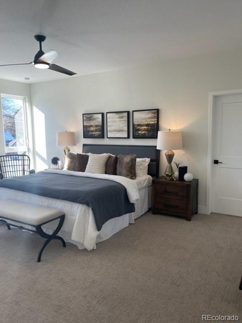 2951 East Evans Avenue Denver, CO 80210 - Photo 34 of 39 a bedroom with a bed and a chandelier