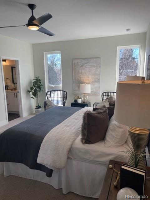 2951 East Evans Avenue Denver, CO 80210 - Photo 35 of 39 a bedroom with a large bed and a couch