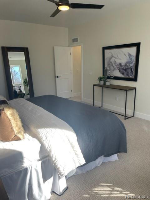 2951 East Evans Avenue Denver, CO 80210 - Photo 38 of 39 a bedroom with a bed and painting on the wall