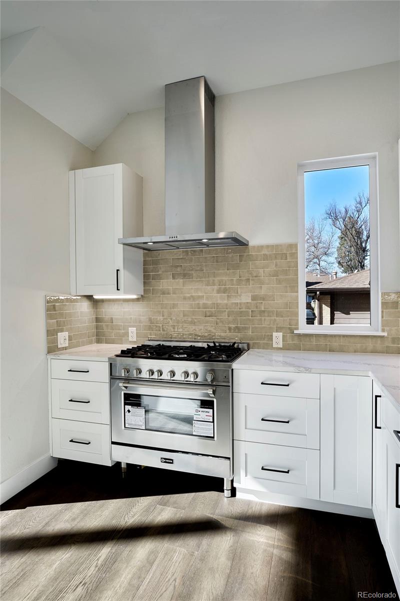 2951 East Evans Avenue Denver, CO 80210 - Photo 5 of 39 a kitchen with appliances and cabinets