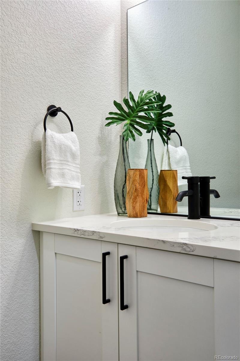 2951 East Evans Avenue Denver, CO 80210 - Photo 7 of 39 a vase of flowers sitting on a table