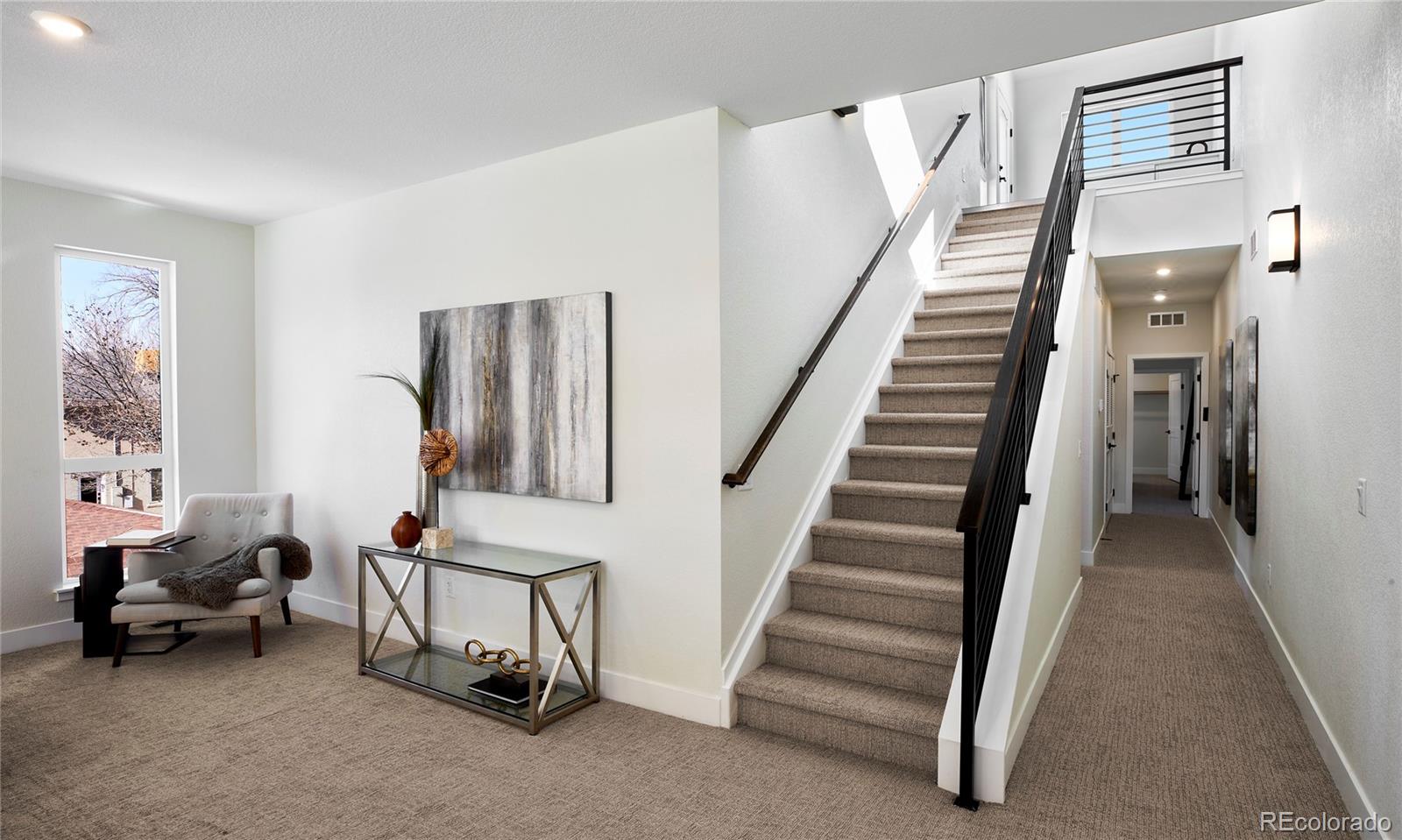 2951 East Evans Avenue Denver, CO 80210 - Photo 9 of 39 a view of a livingroom with furniture and stairs