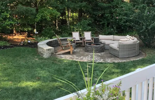 a view of a backyard with sitting area