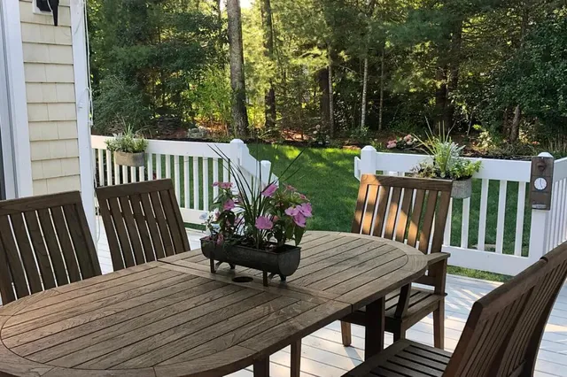 a view of a table and chairs on the roof deck
