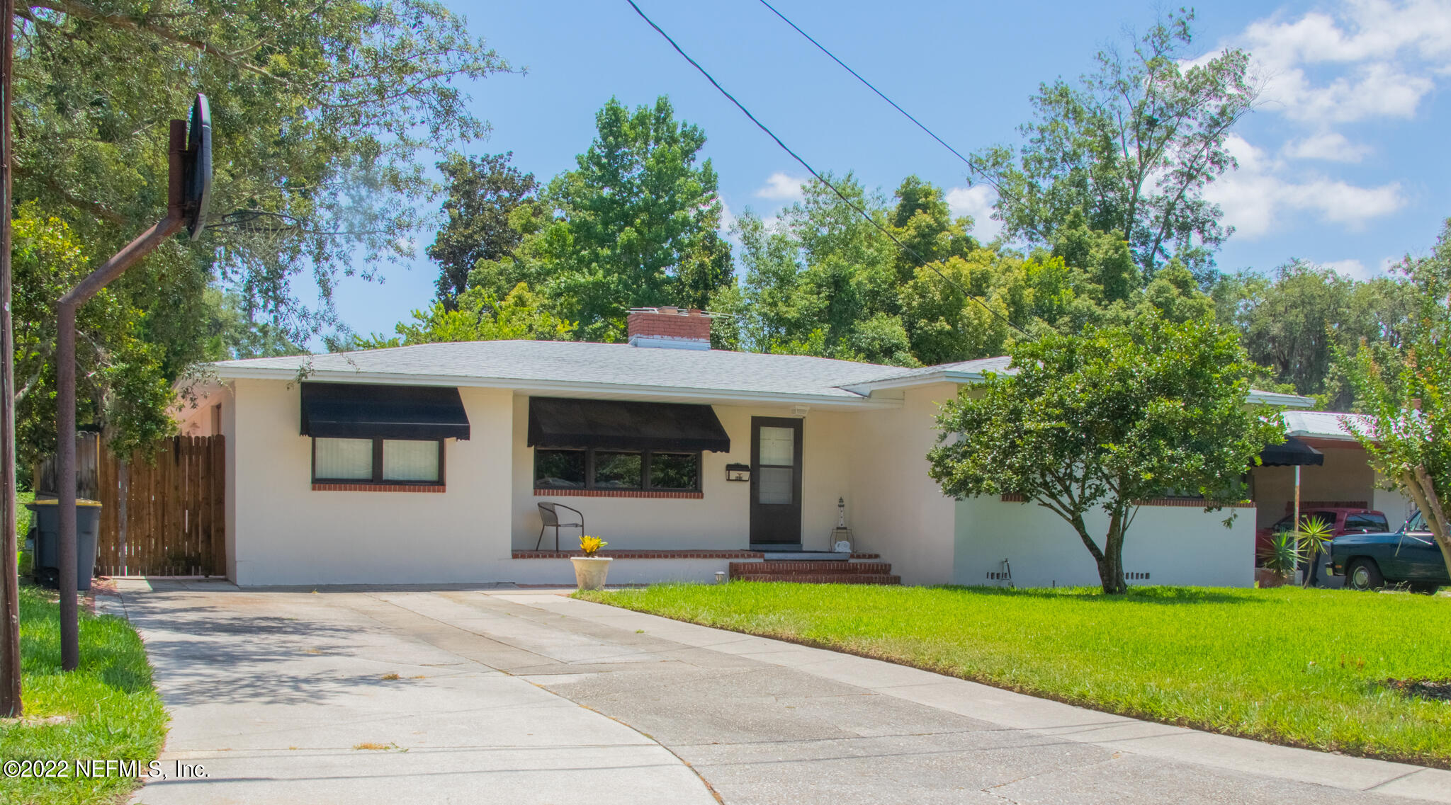 6415 Wesleyan Road Jacksonville, FL 32217 - Photo 1 of 36 a front view of a house with a yard and garage