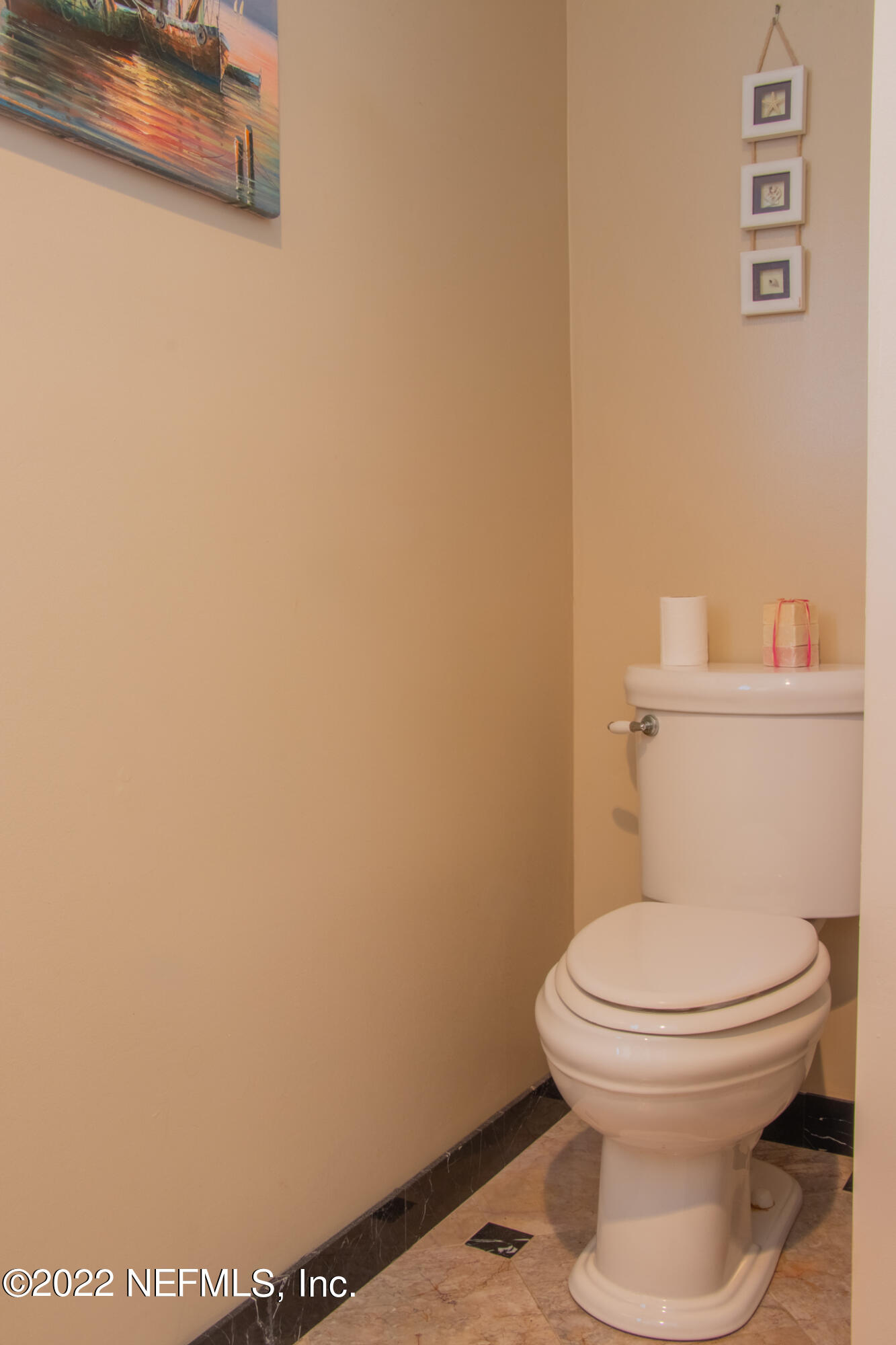 6415 Wesleyan Road Jacksonville, FL 32217 - Photo 17 of 36 a white toilet sitting next to a white wall