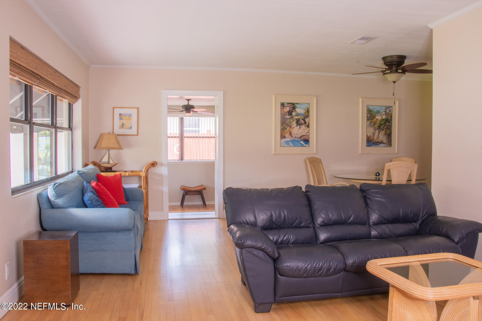 6415 Wesleyan Road Jacksonville, FL 32217 - Photo 2 of 36 a living room with furniture and a wooden floor