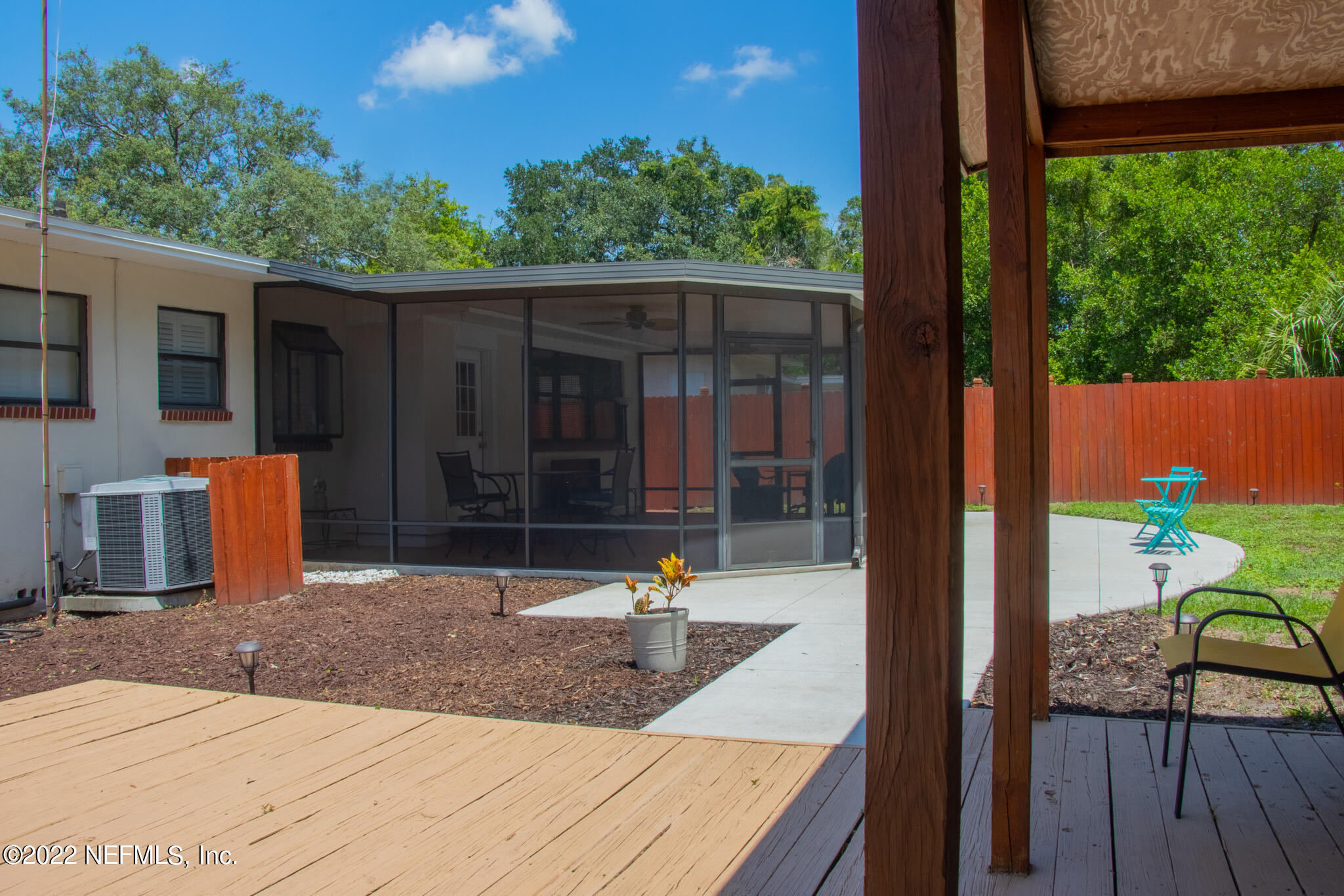 6415 Wesleyan Road Jacksonville, FL 32217 - Photo 29 of 36 a backyard of a house with seating space