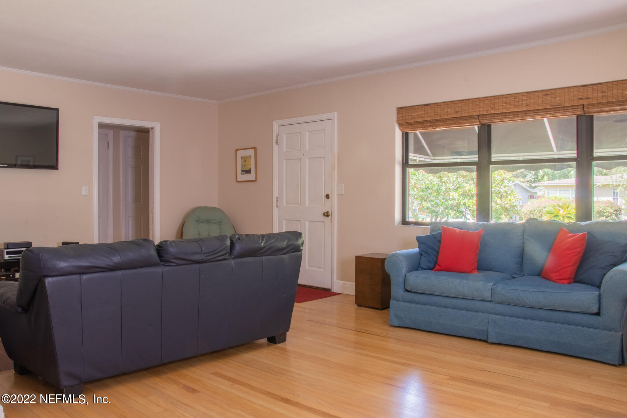 6415 Wesleyan Road Jacksonville, FL 32217 - Photo 7 of 36 a living room with furniture and a flat screen tv