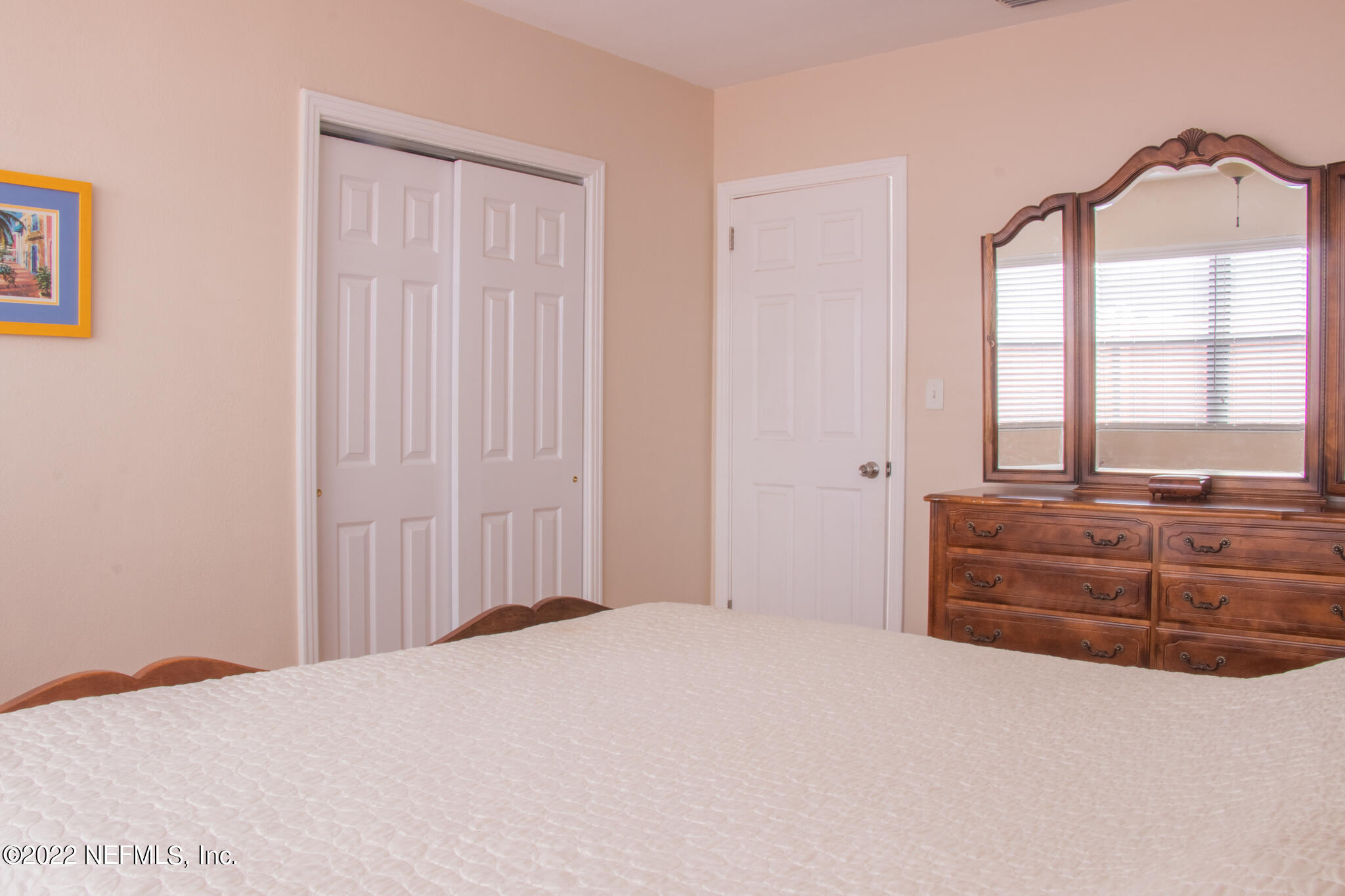 6415 Wesleyan Road Jacksonville, FL 32217 - Photo 10 of 36 a bedroom with a bed and a dresser
